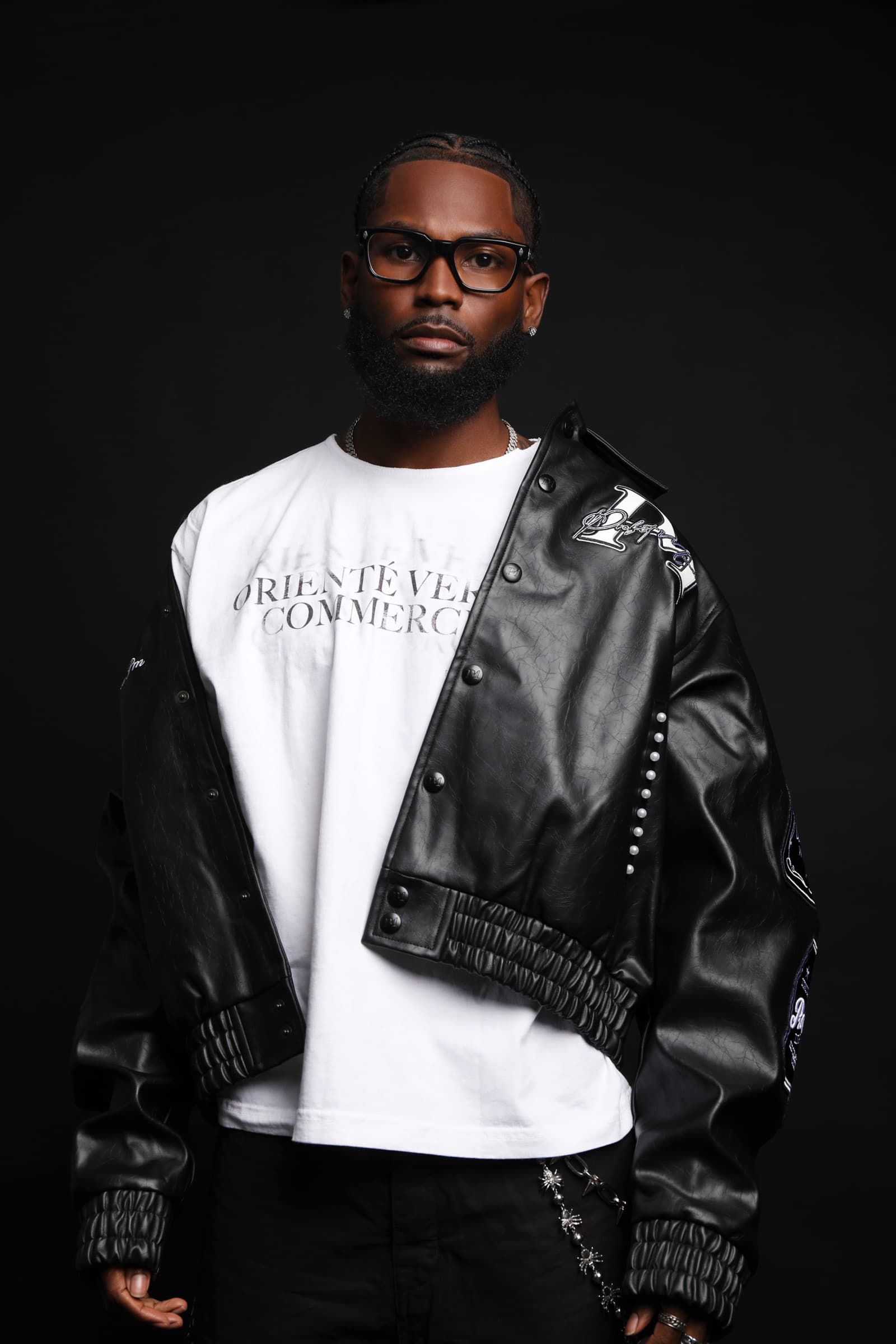 Sly Huncho in a black leather jacket for a product and brand portrait